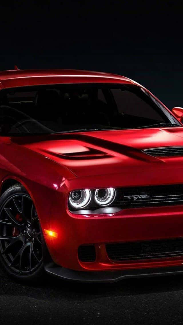 Den røde Dodge Challenger SRT vises i et mørkt rum. Wallpaper