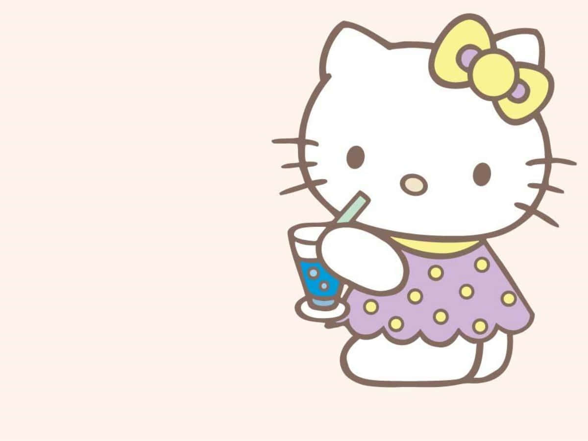 Laptopcon Temática De Hello Kitty Tomando Una Bebida. Fondo de pantalla