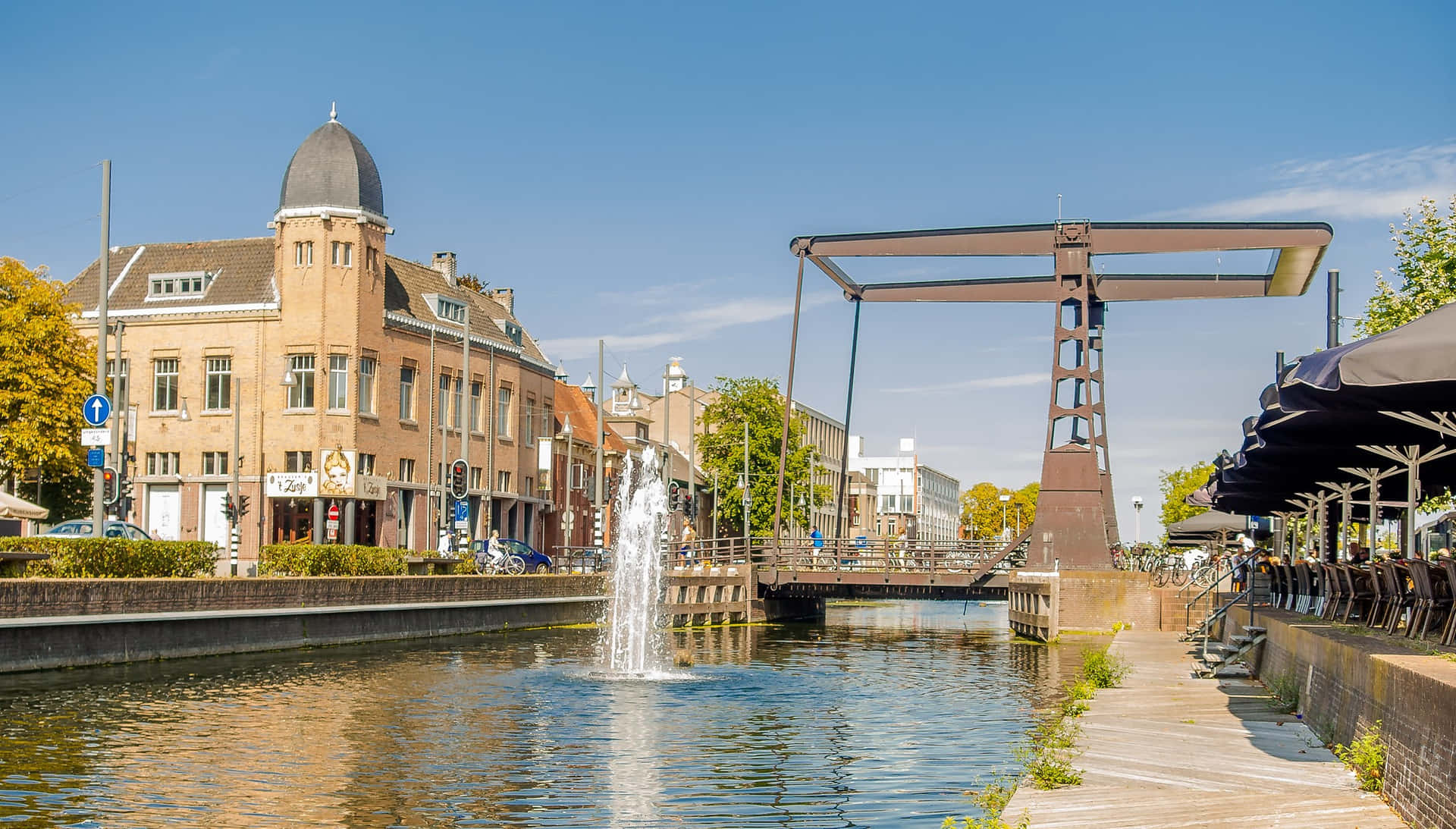 Helmond Canal Viewwith Bridgeand Fountain Wallpaper