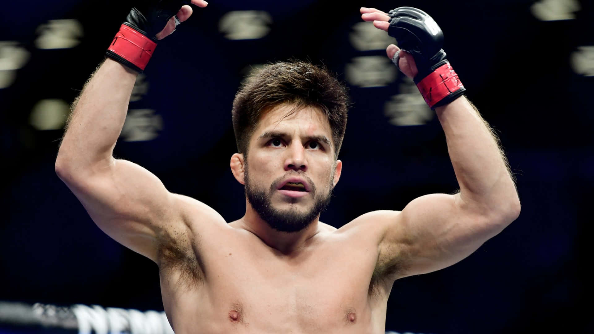 Professional MMA Fighter Henry Cejudo Standing Proudly in Barclays Center Wallpaper