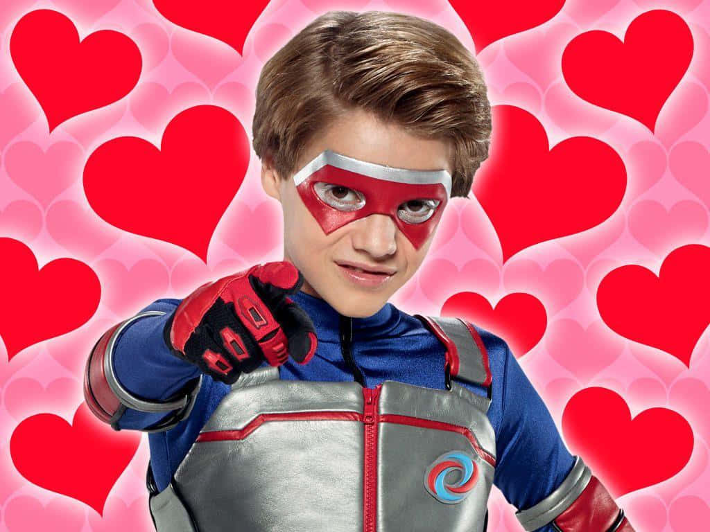 A Boy In A Superhero Costume Is Pointing At Hearts Wallpaper