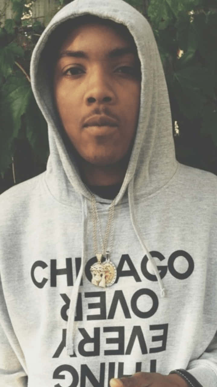 A Man Wearing A Hoodie With The Word Chicago On It Wallpaper