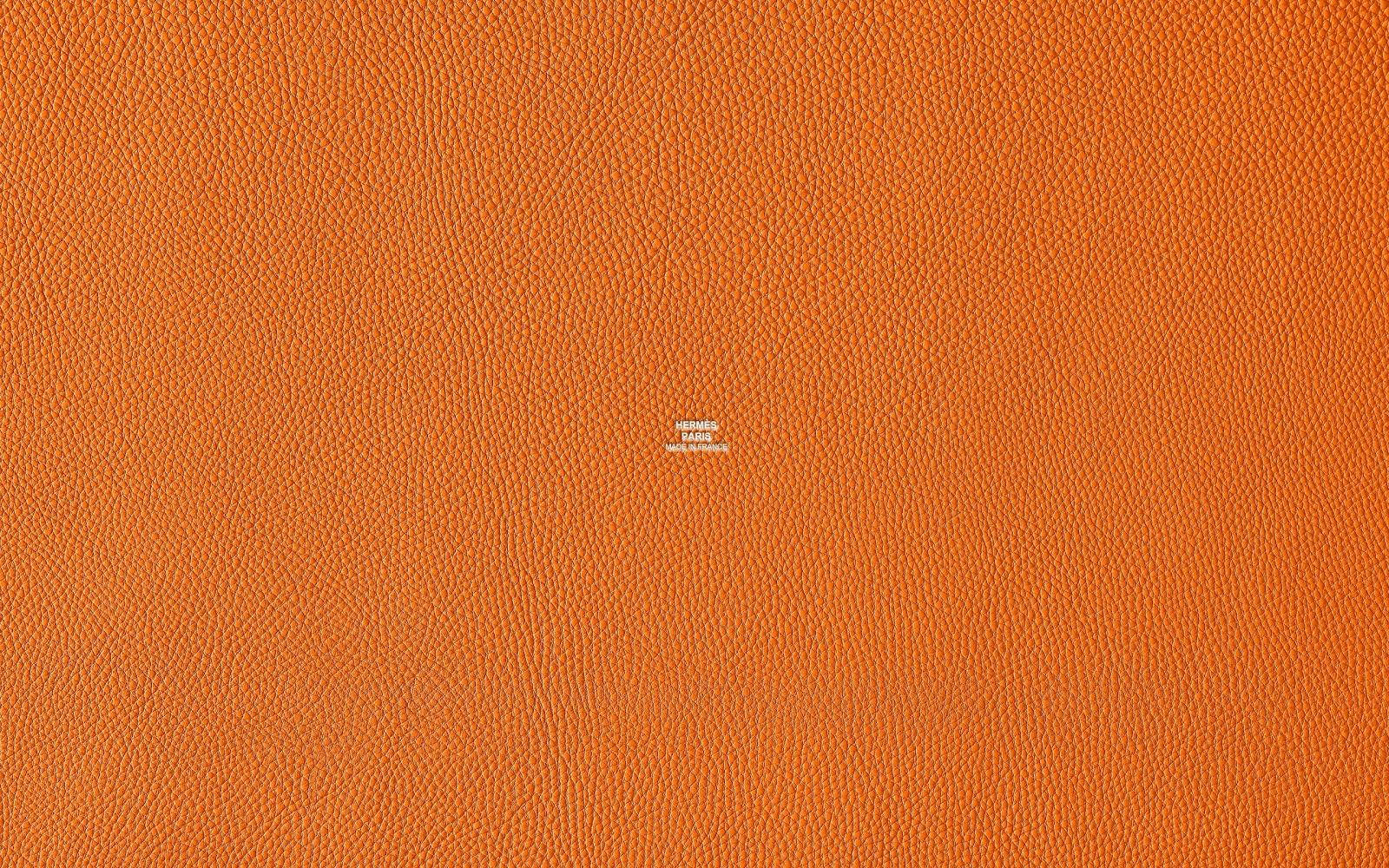 Hermes Logo På Tekstureret Orange Baggrund Wallpaper