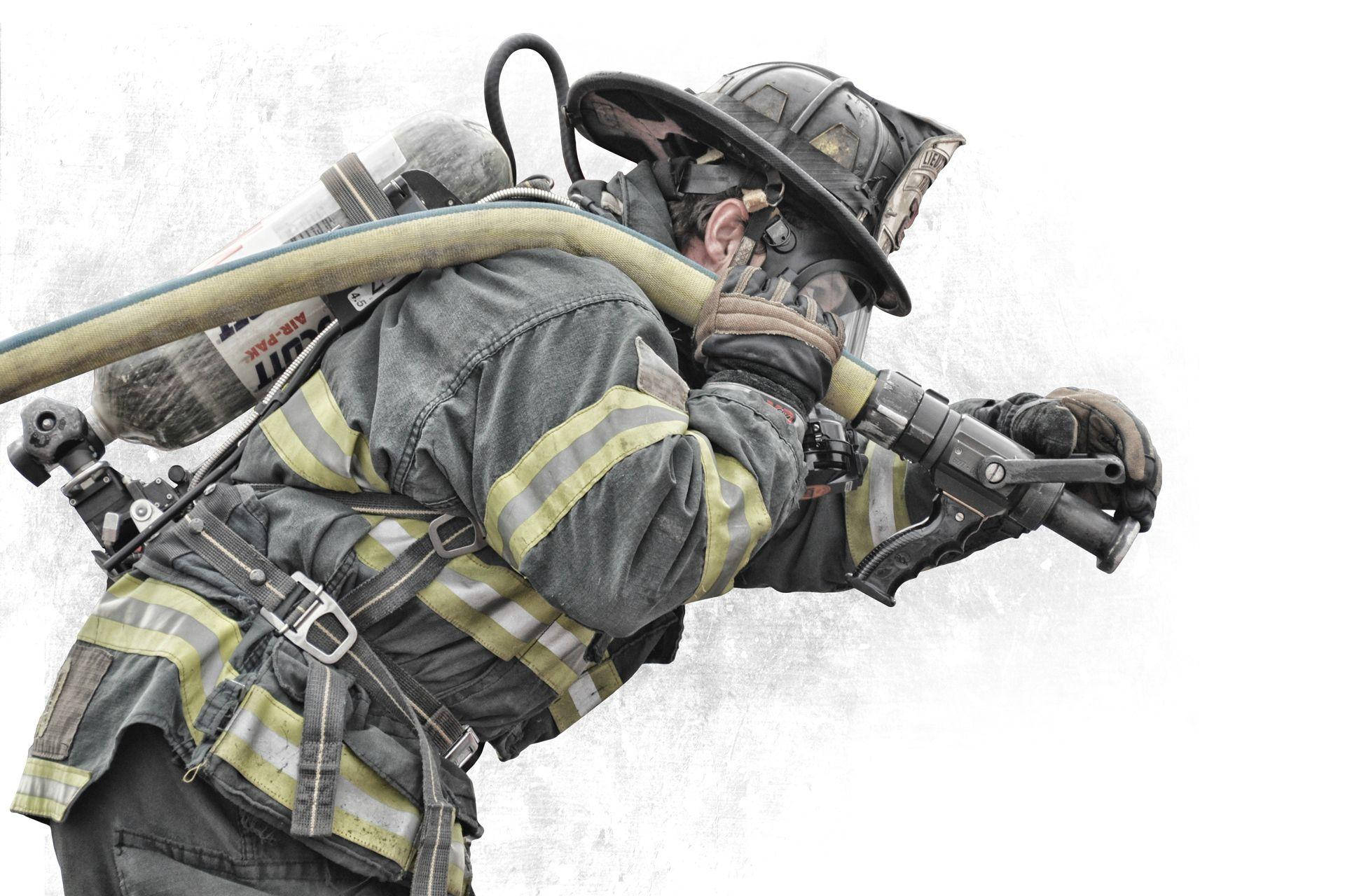Heroic Firefighters With Water Hose Wallpaper
