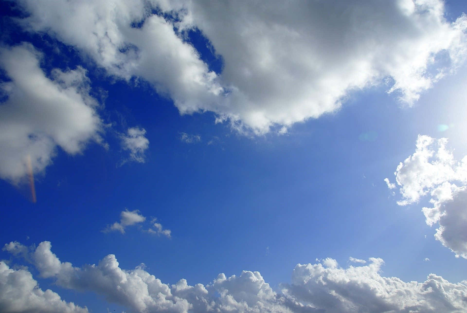 Hi Res Sky With Frame Of Clouds Wallpaper