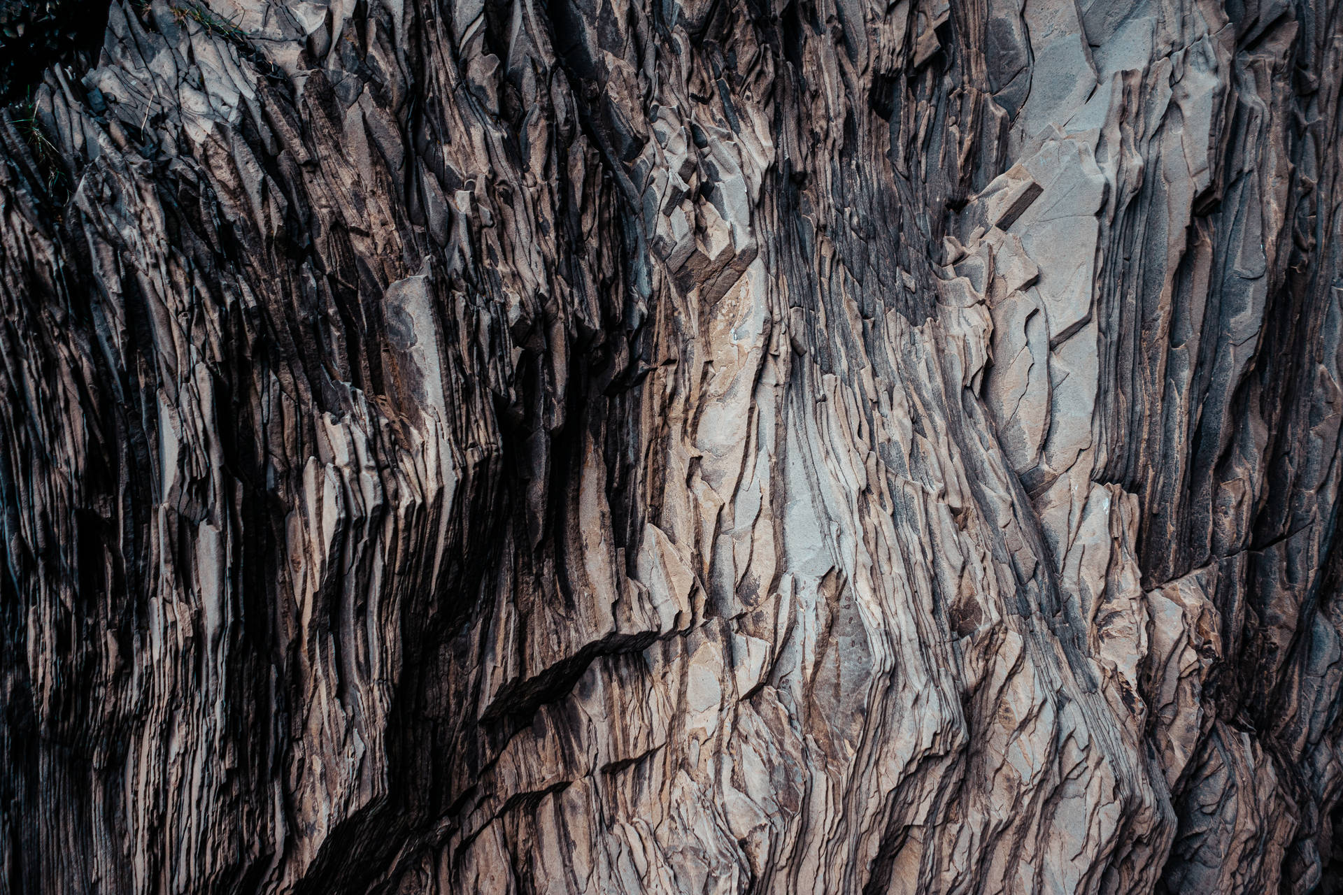 Hi Res Texture Of A Layered Dark Rock Wallpaper