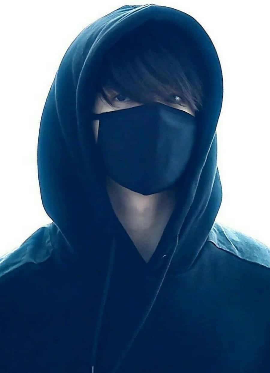 A Man Wearing A Black Hoodie With A Black Mask