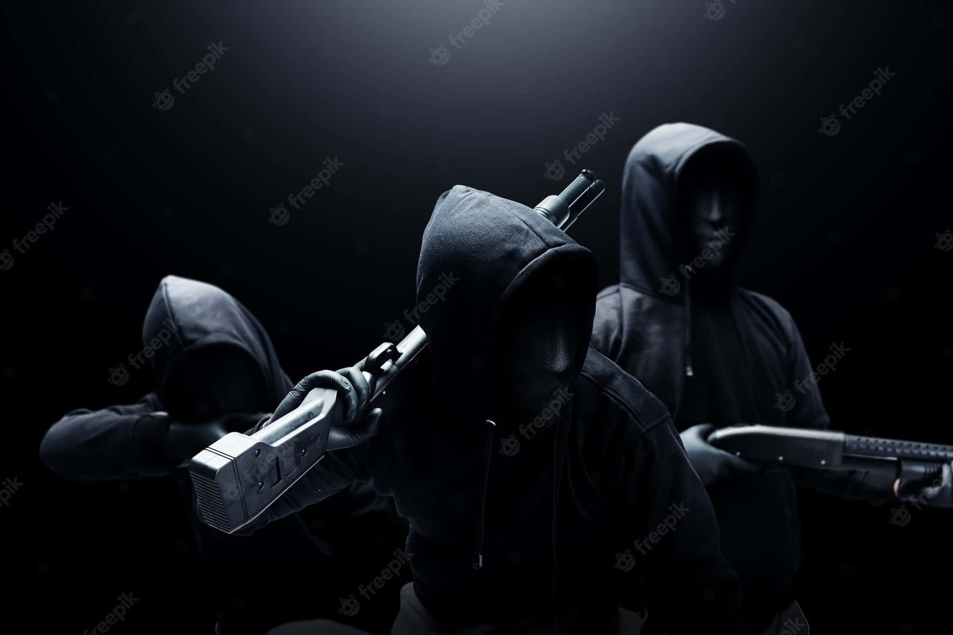 Three Hooded Men With Guns On A Dark Background Wallpaper