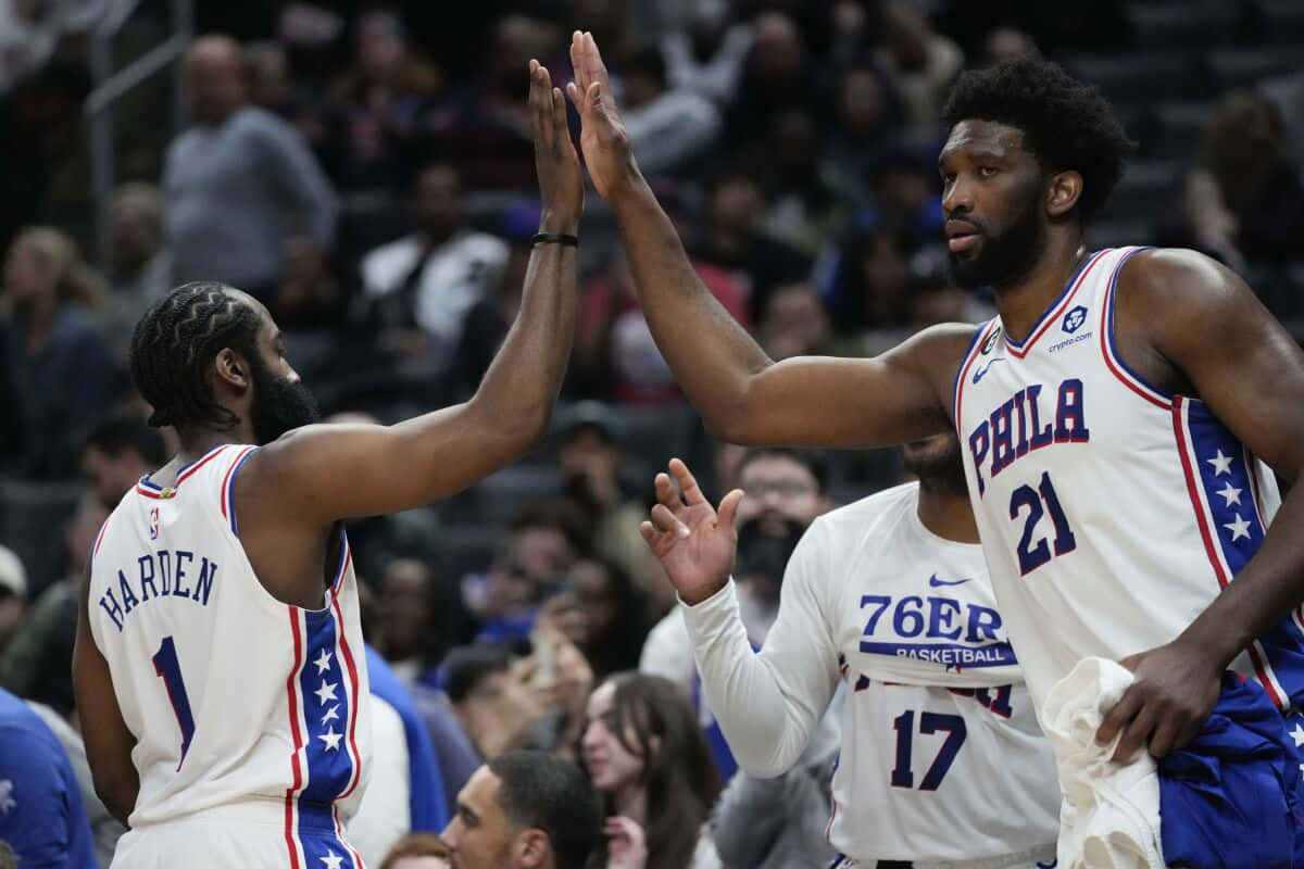 Philadelphia 76ers Players High Five Each Other During A Game