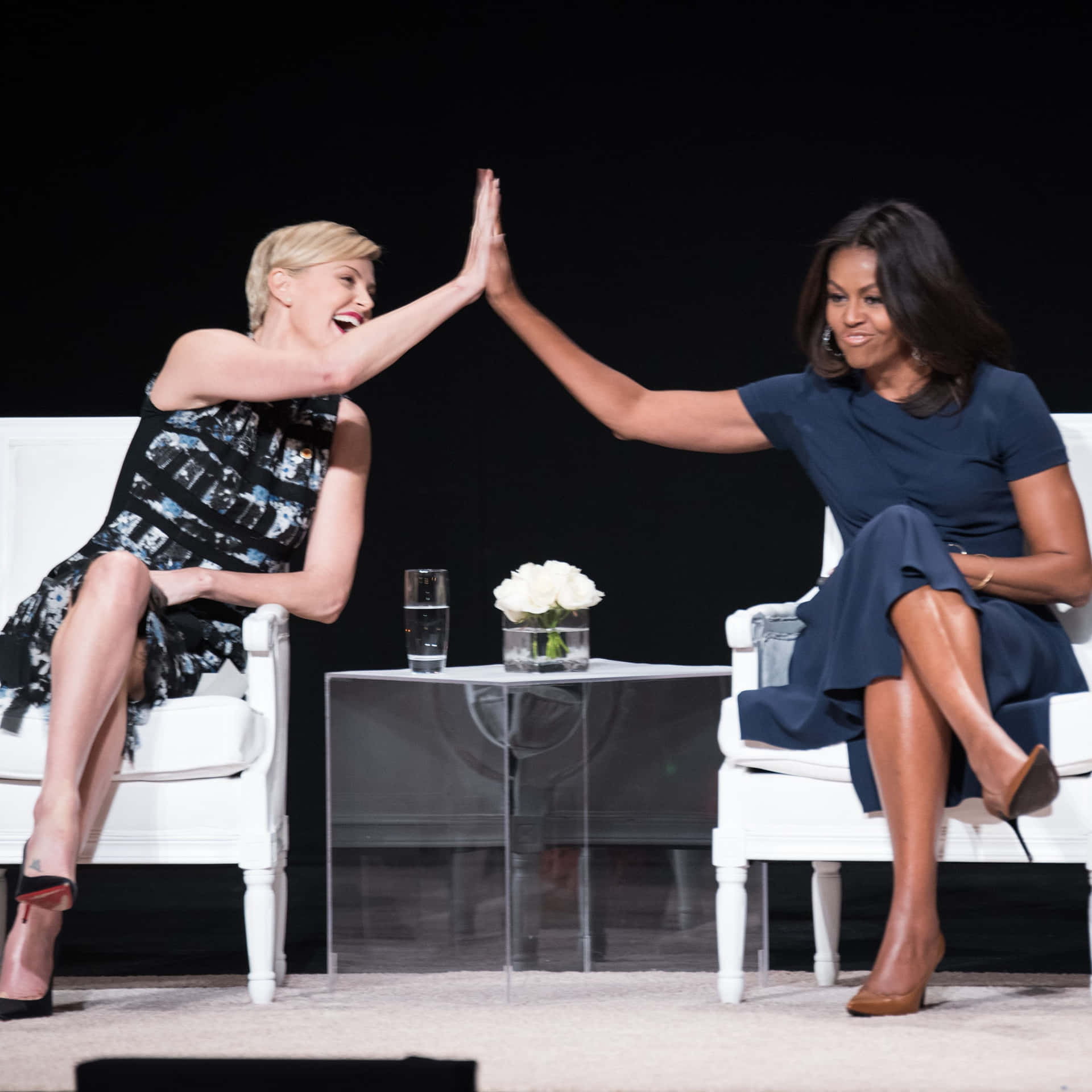 High Five Of Michelle Obama And Charlize Theron Pictures