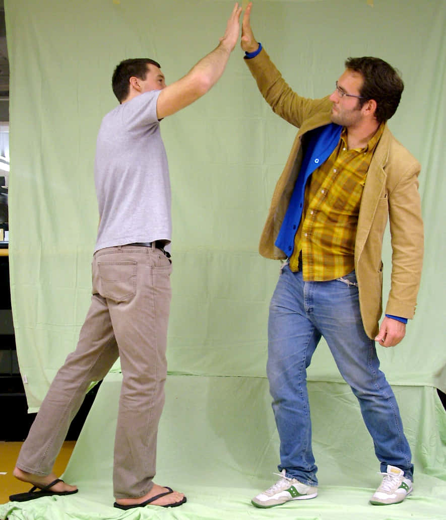 Two Men Giving High Five Pictures