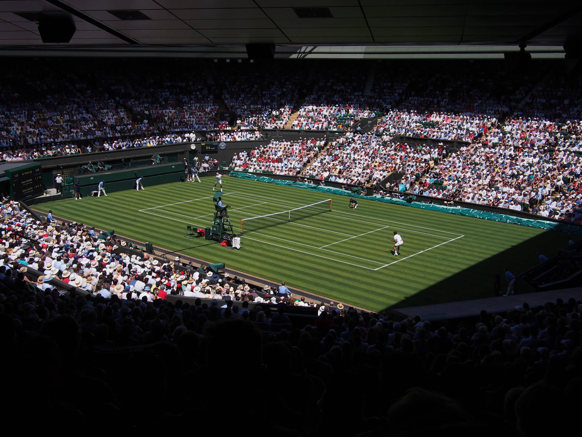 Caption: Splendid View of the Iconic Wimbledon Tennis Court Wallpaper