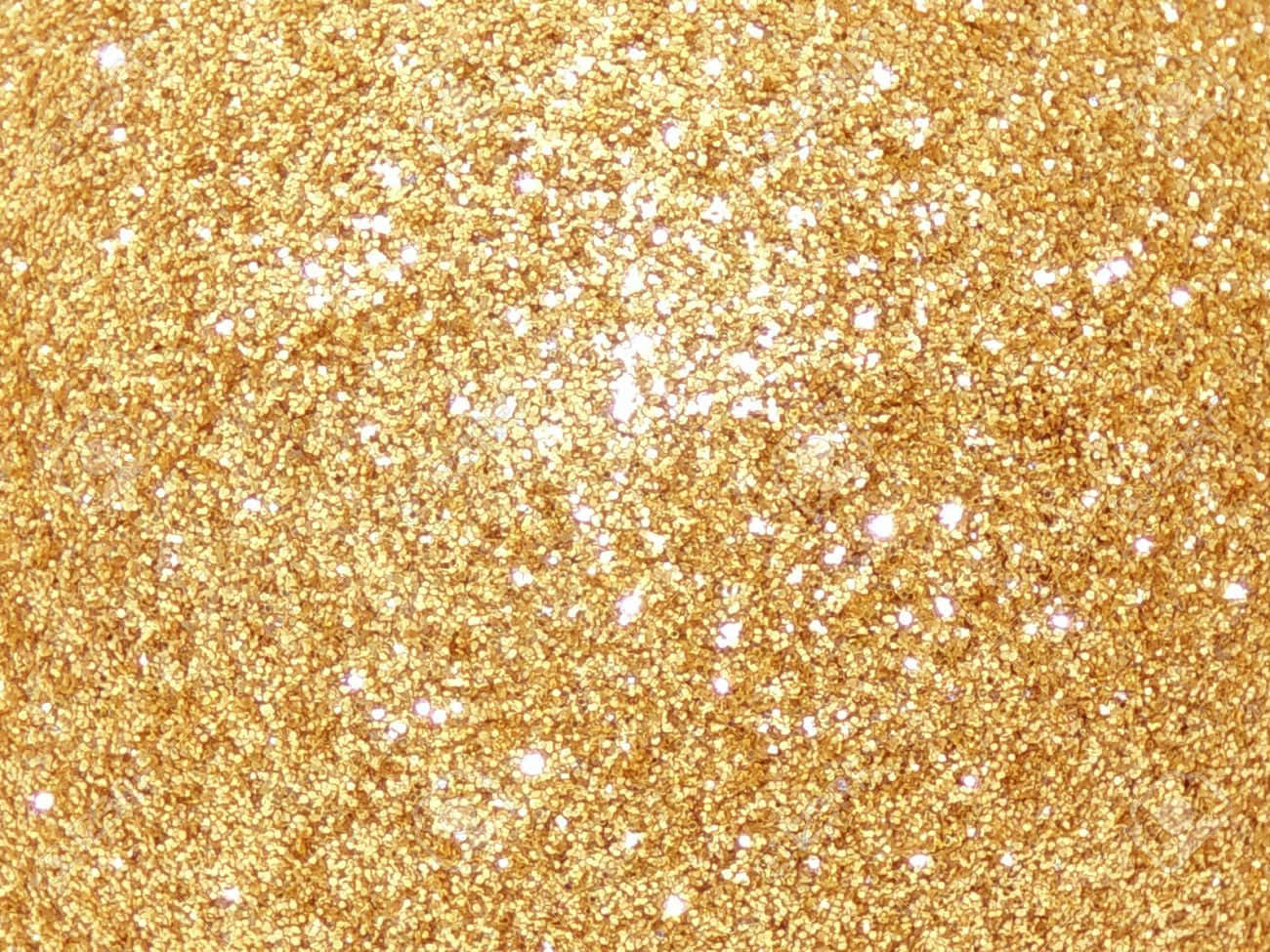 Discover the finishing touch of luxury with a gold glitter background