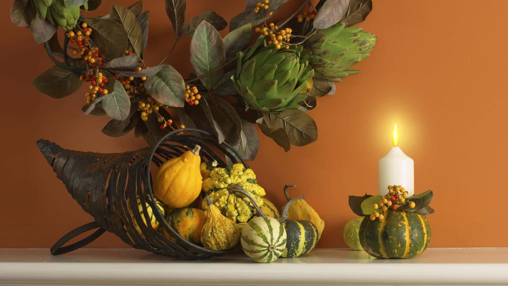 High Resolution Thanksgiving Small Pumpkins With A Candle Background