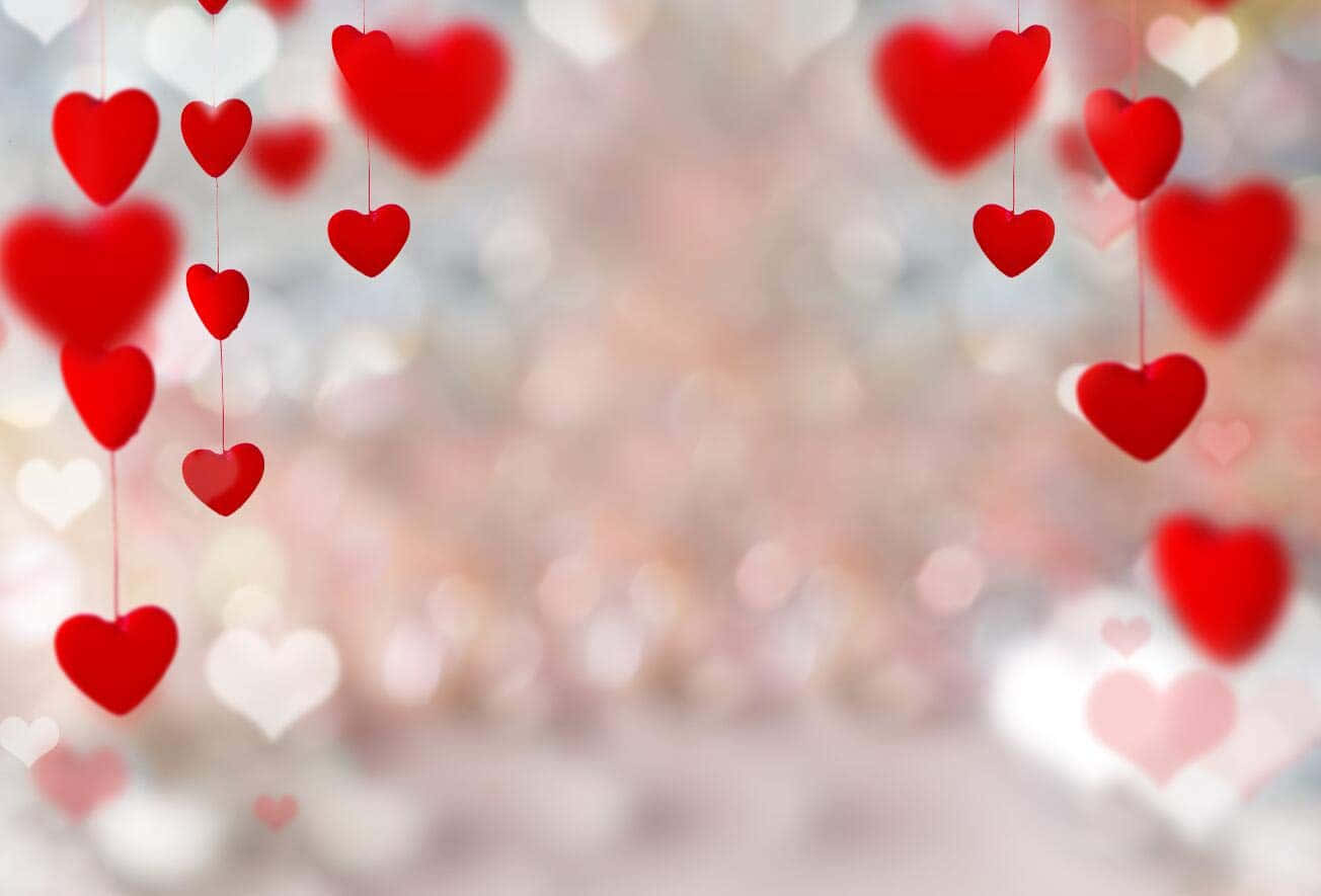 Valentine's Day Background With Hearts Hanging From The Ceiling