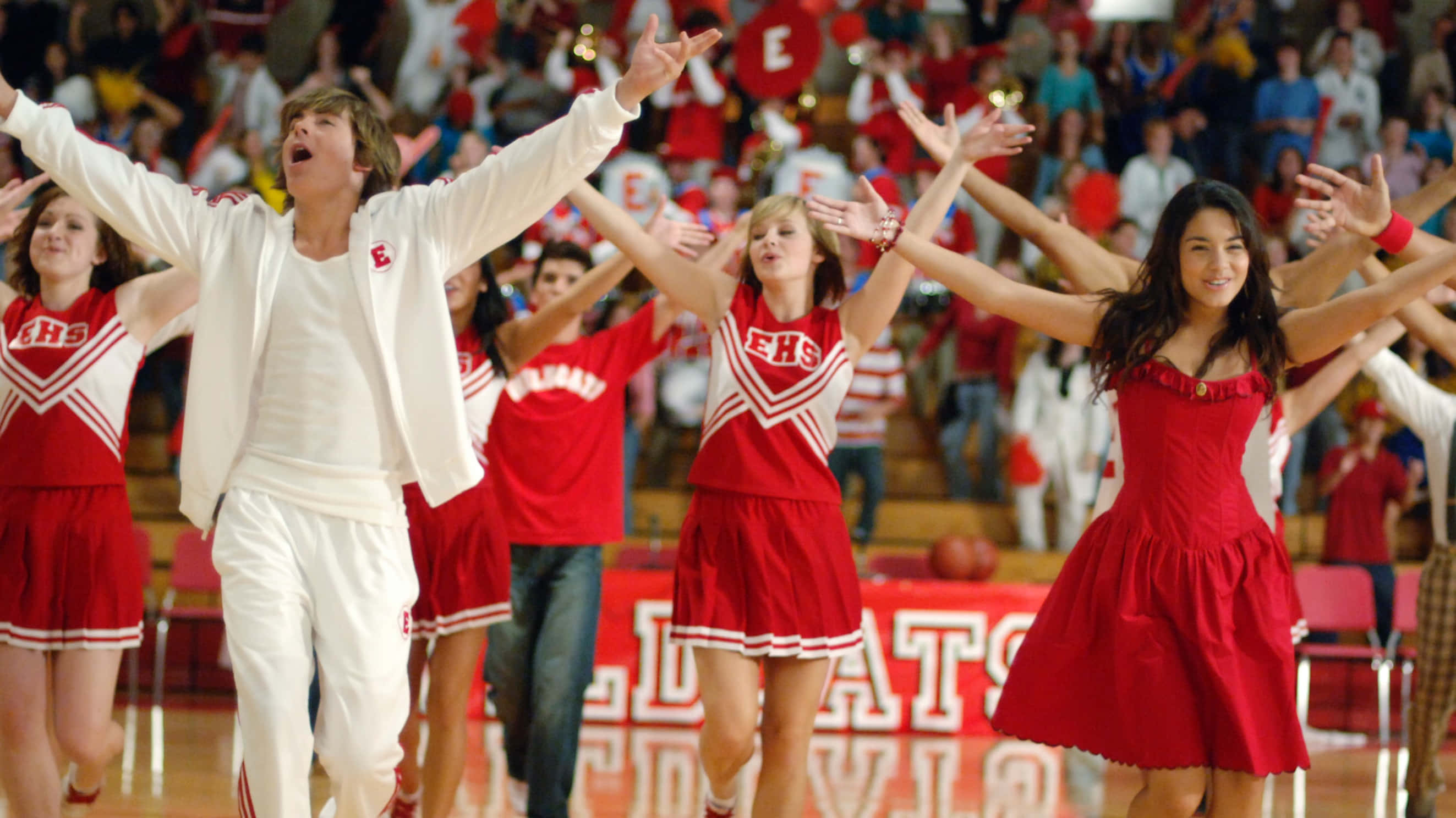 The lively cast of High School Musical gathered together in an unforgettable moment