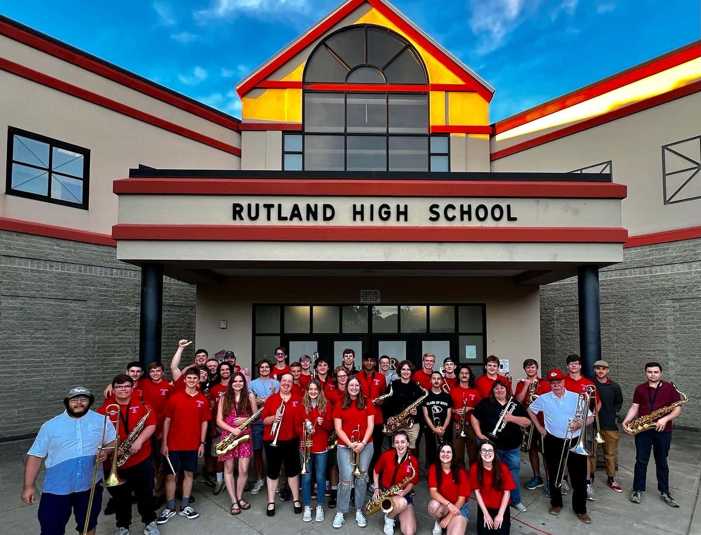 Rutland High School Band Posing Outside Of The Building