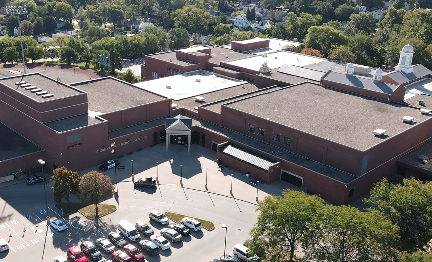 An Aerial View Of A Large Building With Parking Lots