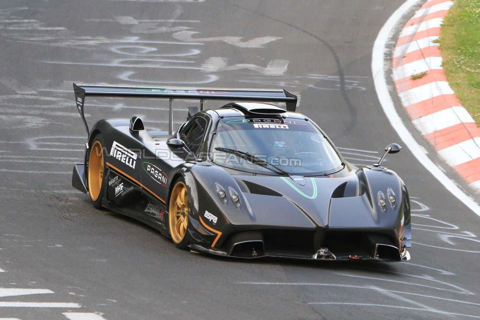 "high-speed Excellence - Pagani Zonda R On Track" Wallpaper