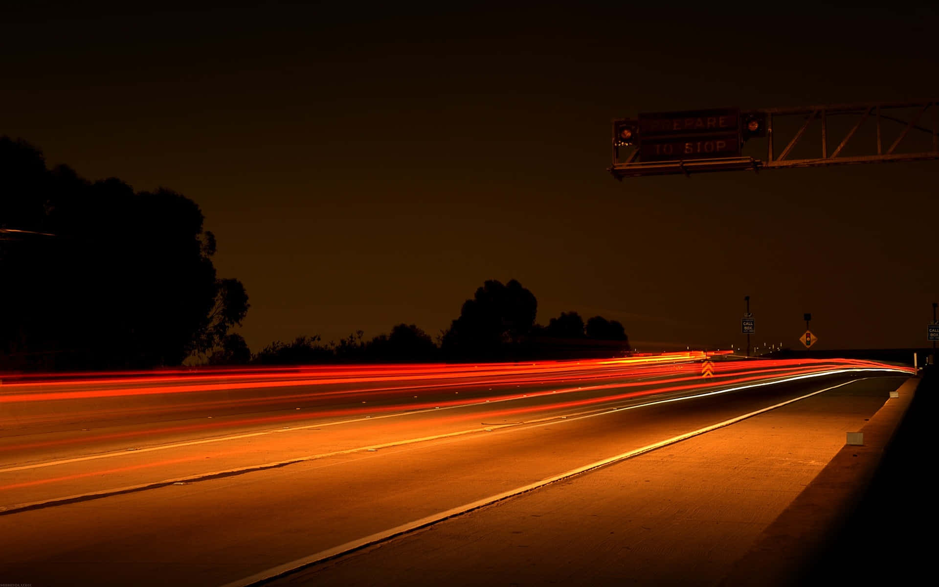 Highway Glowing In Orange Light Wallpaper