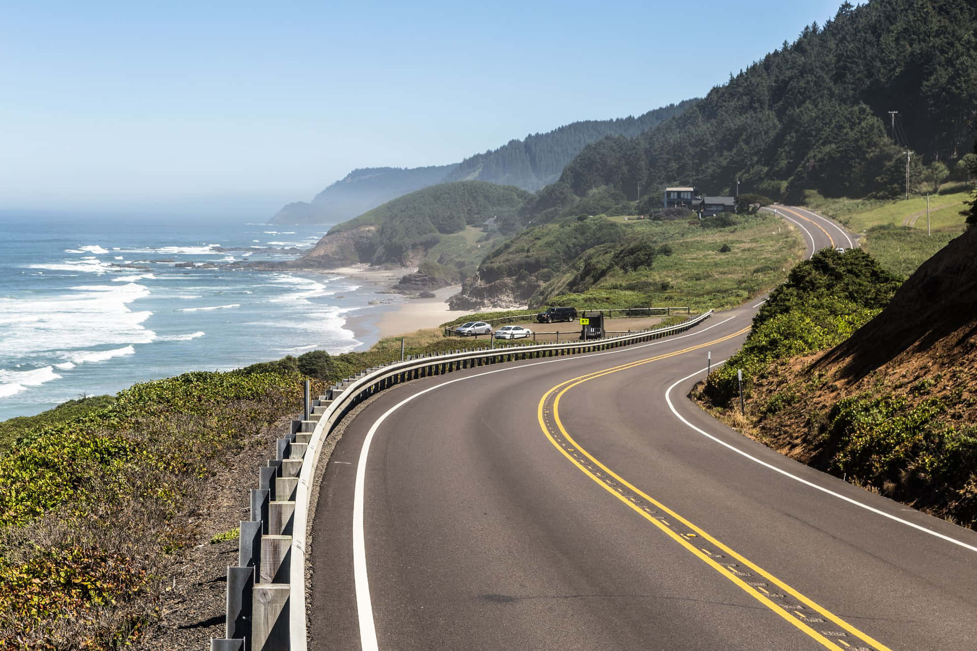 A Road Leading To The Ocean With A View Of The Ocean