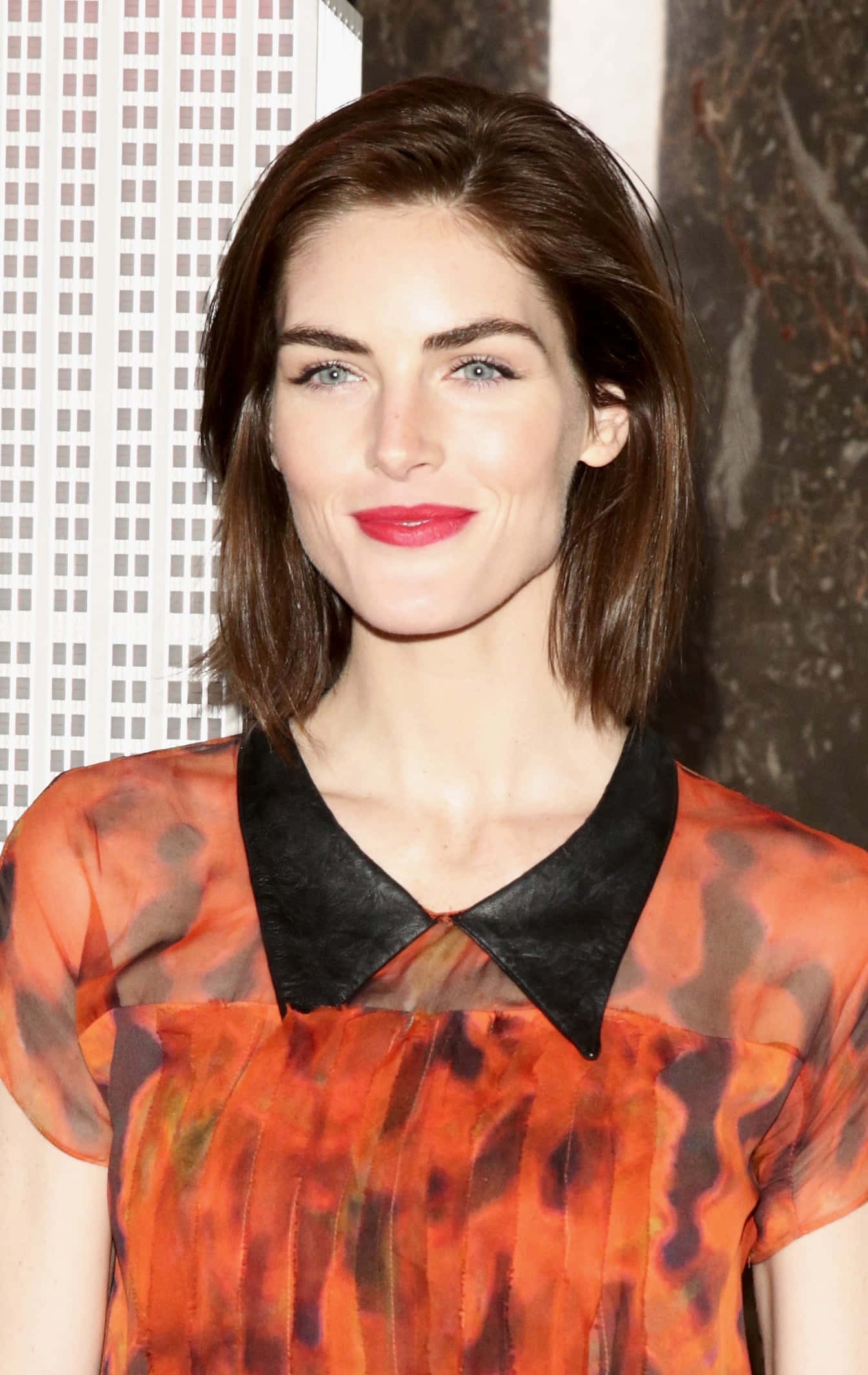 Hilary Rhoda Striking A Pose In A Sophisticated Outfit Wallpaper