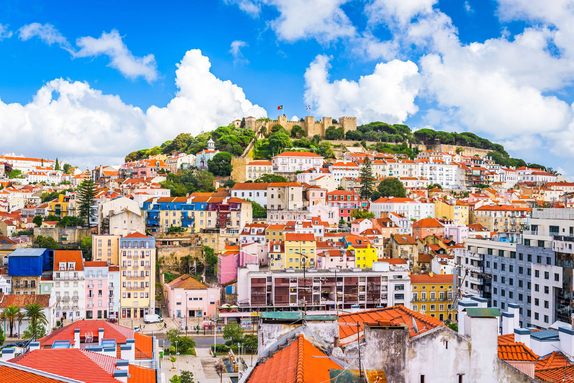 Scenic View of Hilltop Houses at Sunset in Lisbon, Portugal Wallpaper