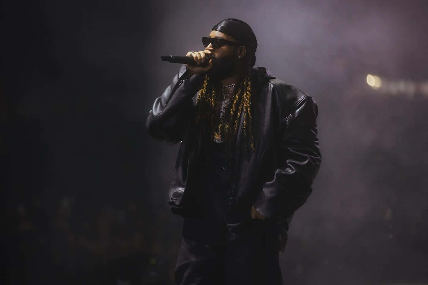 Hip Hop_ Artist_ Performing_on_ Stage.jpg Wallpaper