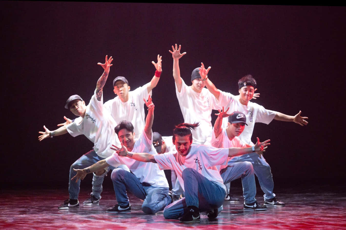A Group Of Young Men On Stage Performing