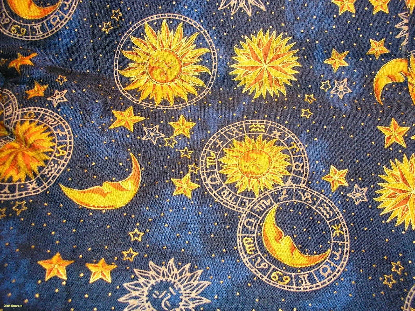 A Blue Fabric With Sun, Moon And Stars On It Wallpaper