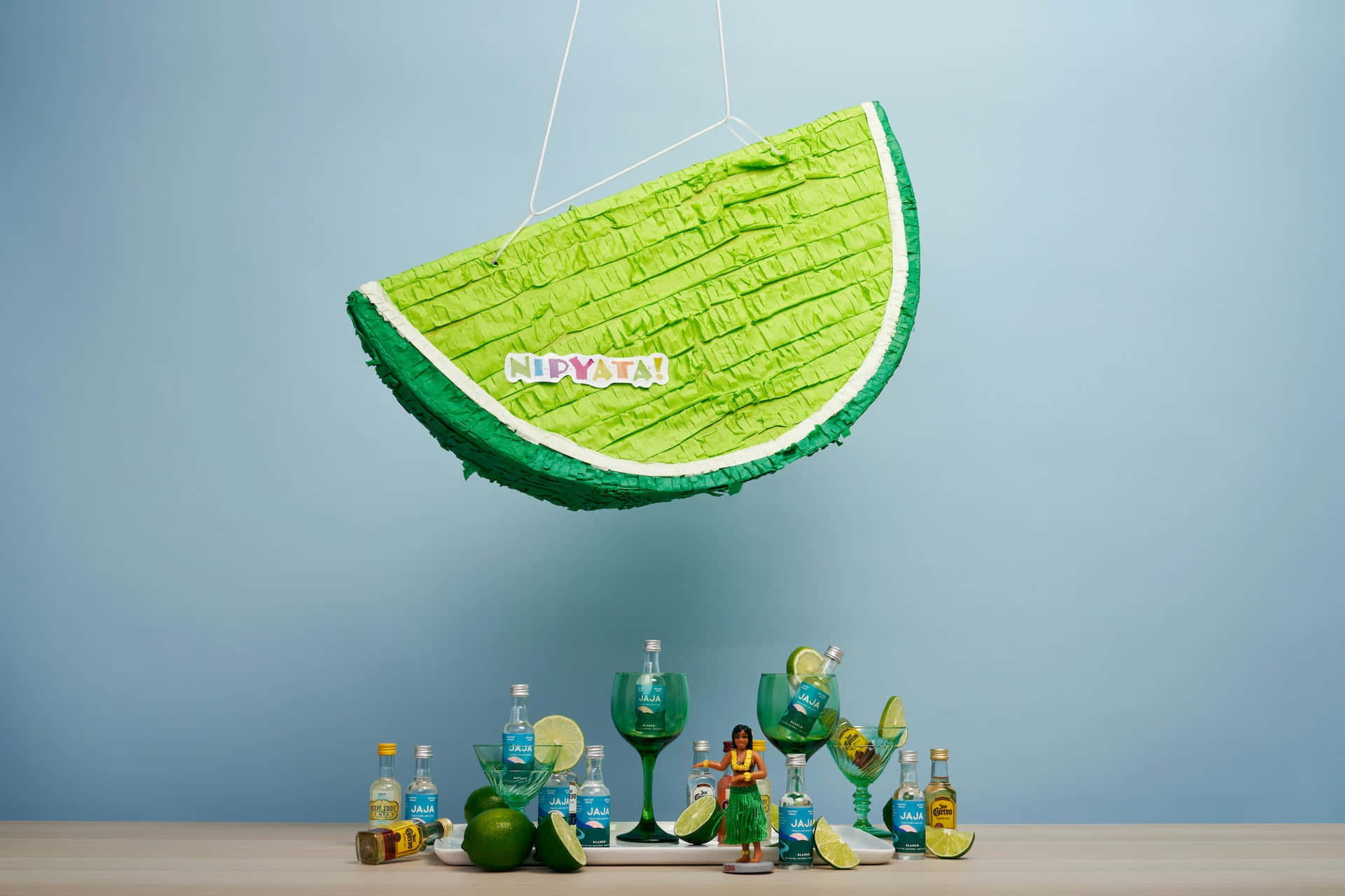 A Pinata With A Slice Of Lime Hanging From It Wallpaper