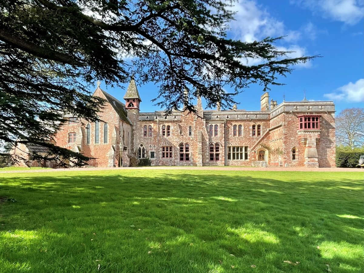 Historic Exeter Building Sunny Day Wallpaper