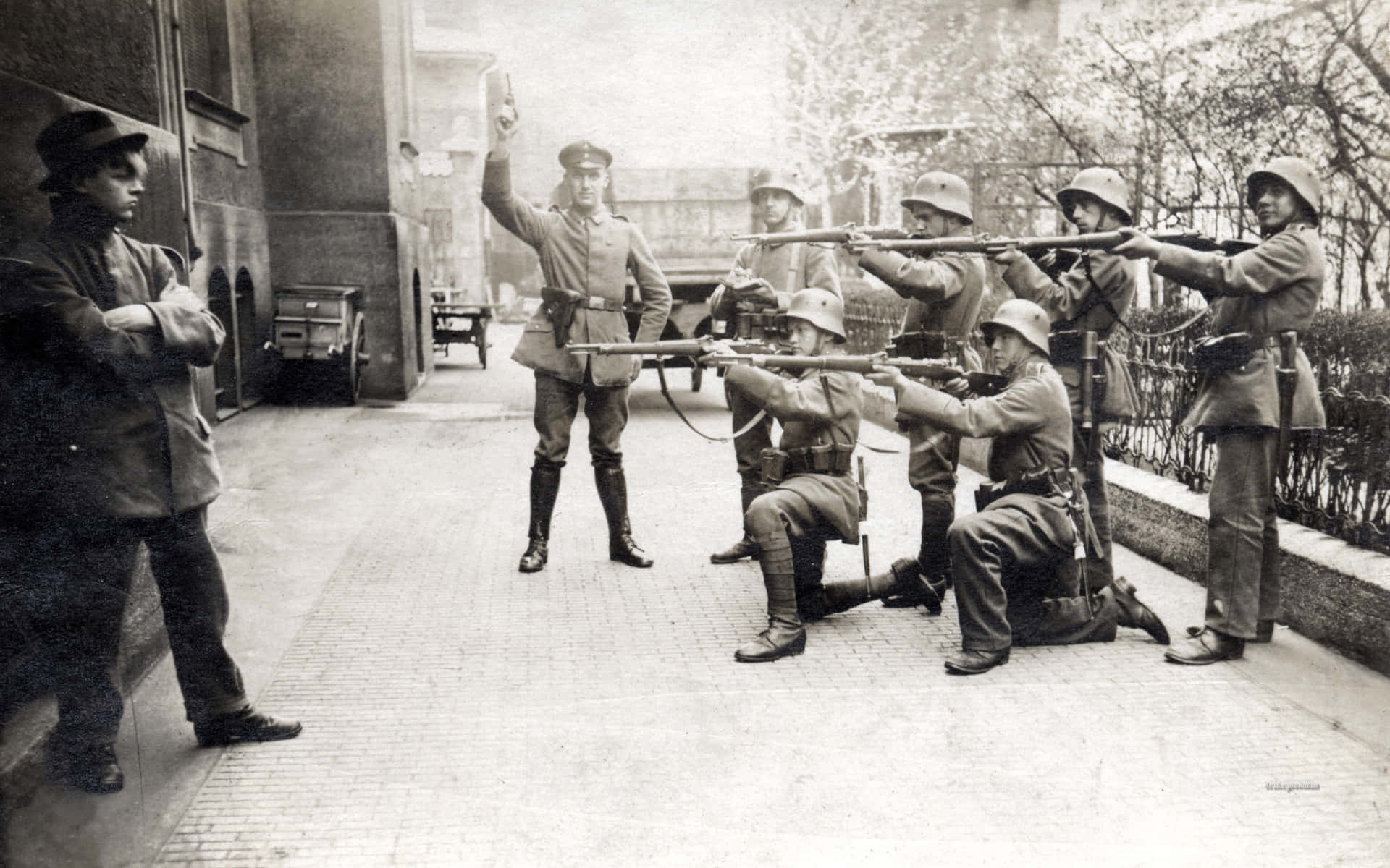 A Group Of Soldiers Are Pointing Their Guns At A Street