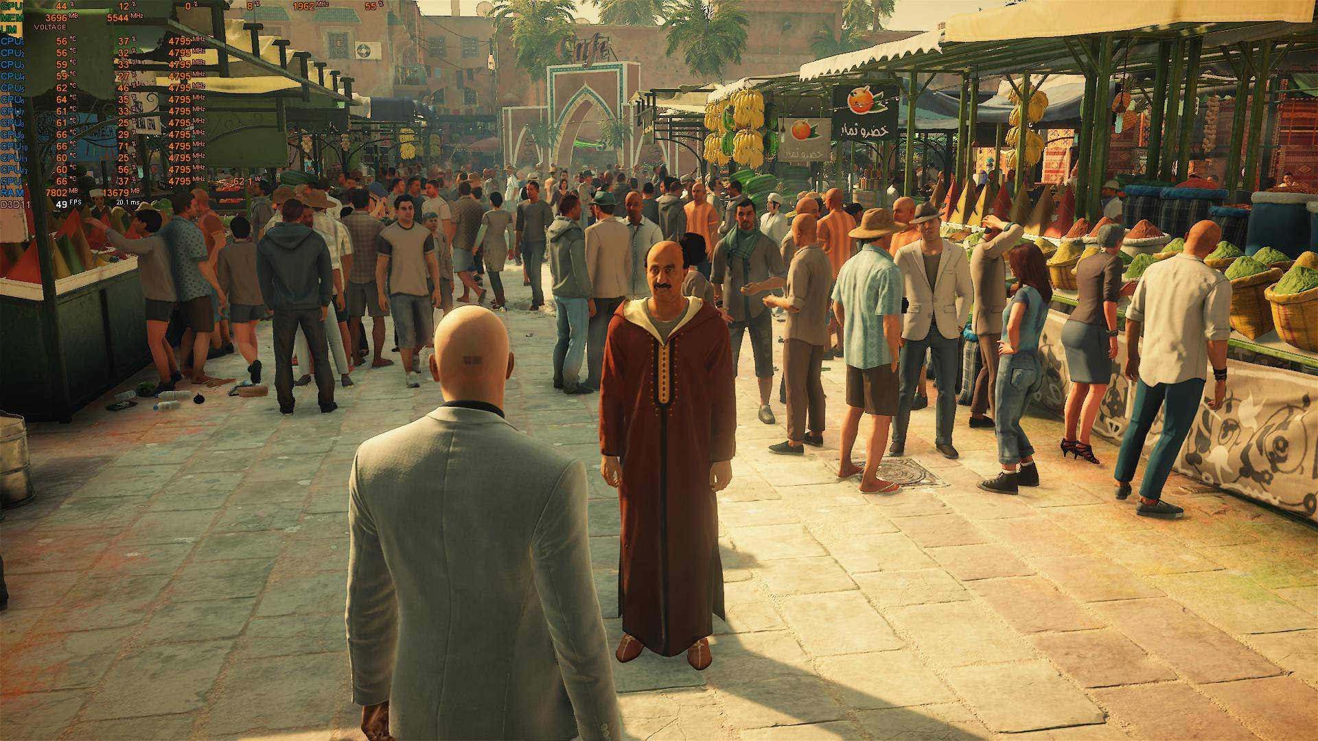 Agent 47 poised in bold stance in an exotic tropical setting of Hitman 2. Wallpaper
