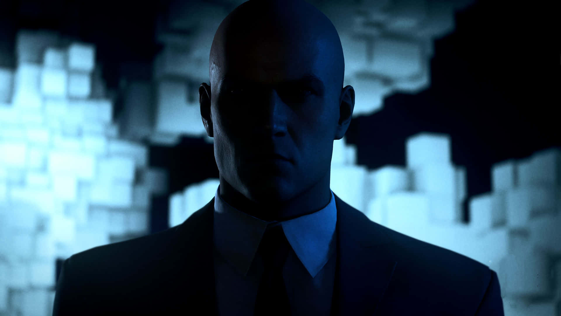 A Man In A Suit Is Standing In Front Of A Dark Background Wallpaper