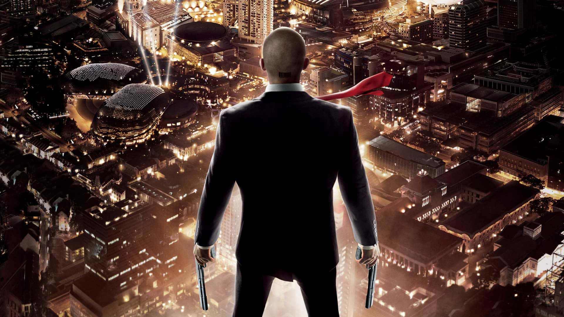 A Man In A Suit Standing On Top Of A City Wallpaper