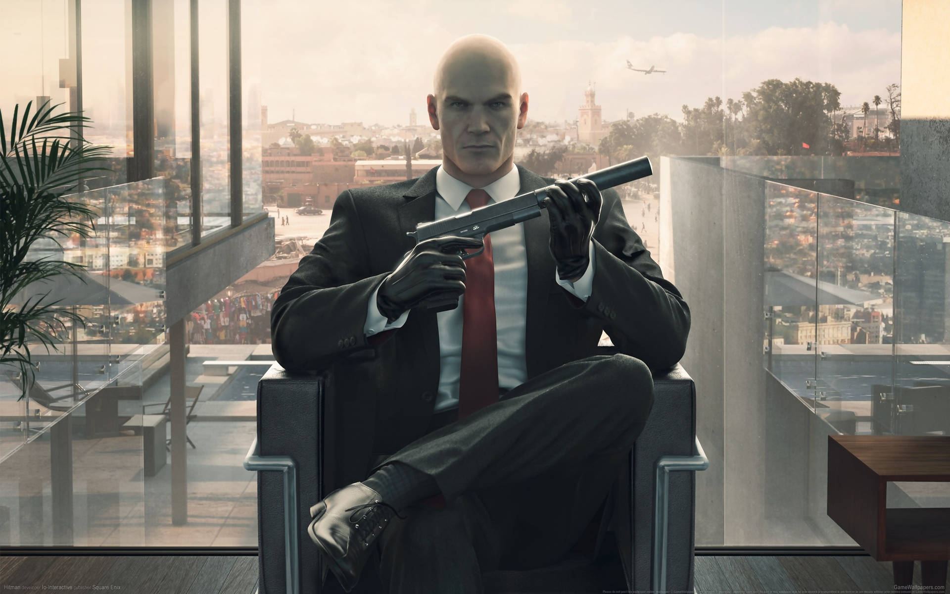 Agent 47 from the Hitman series in a Black suit Wallpaper