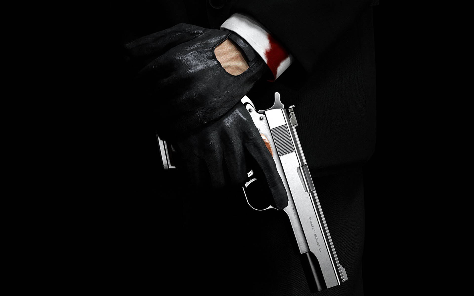Hitman Hand Holding His Handgun Background