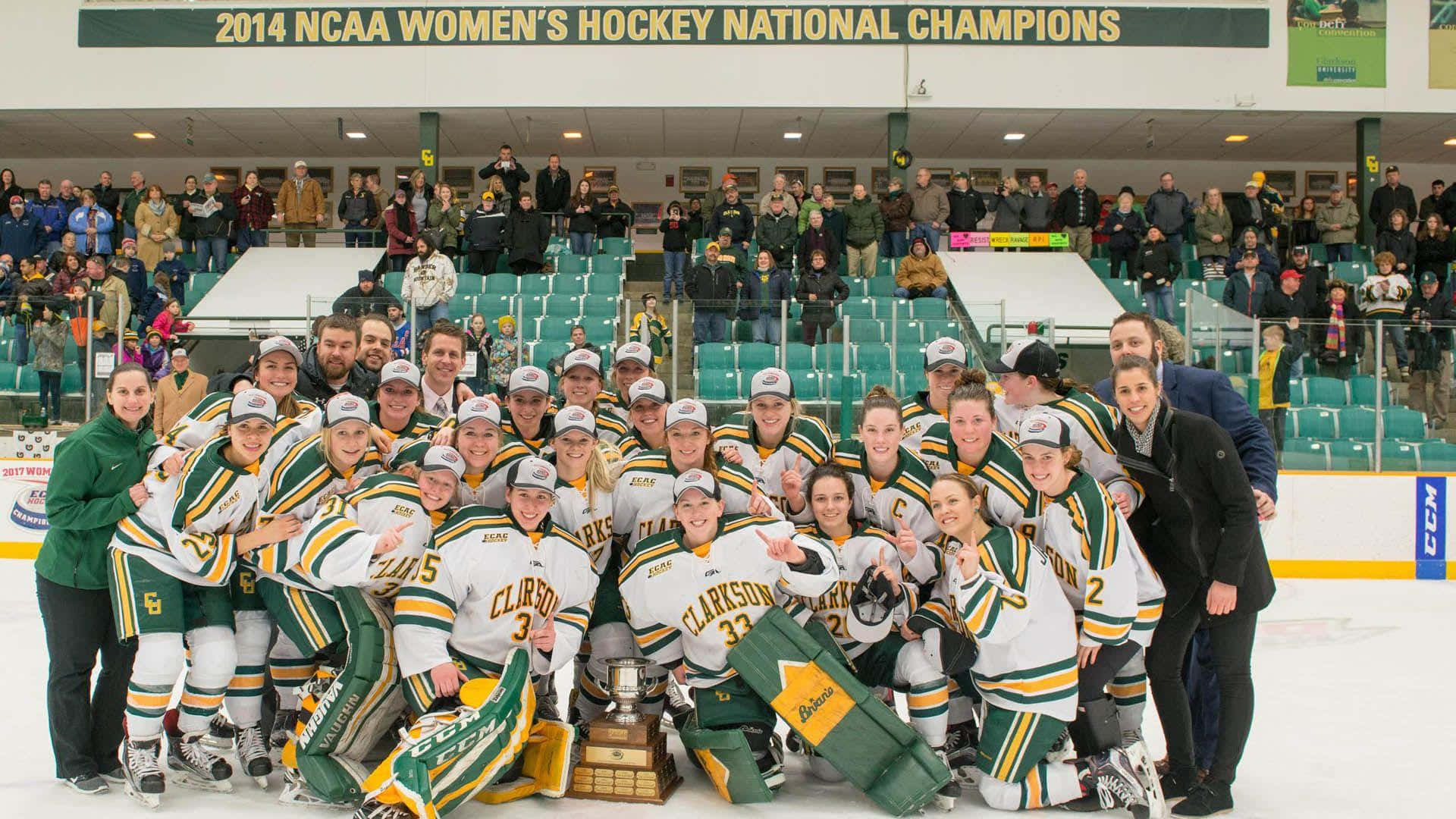 A Group Of Women Hockey Players Pose With Their Trophy