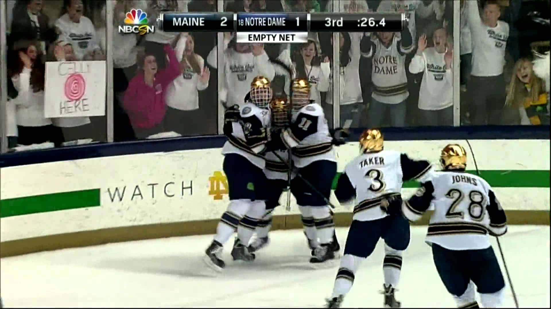 Hockey players vying for the puck