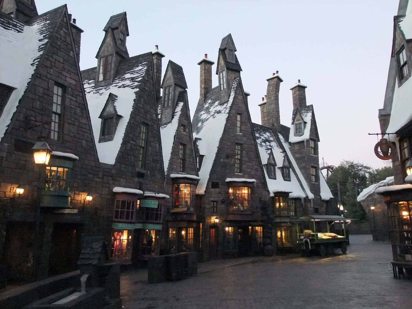 Captivating Scenery of Hogsmeade Village during Winter Wallpaper