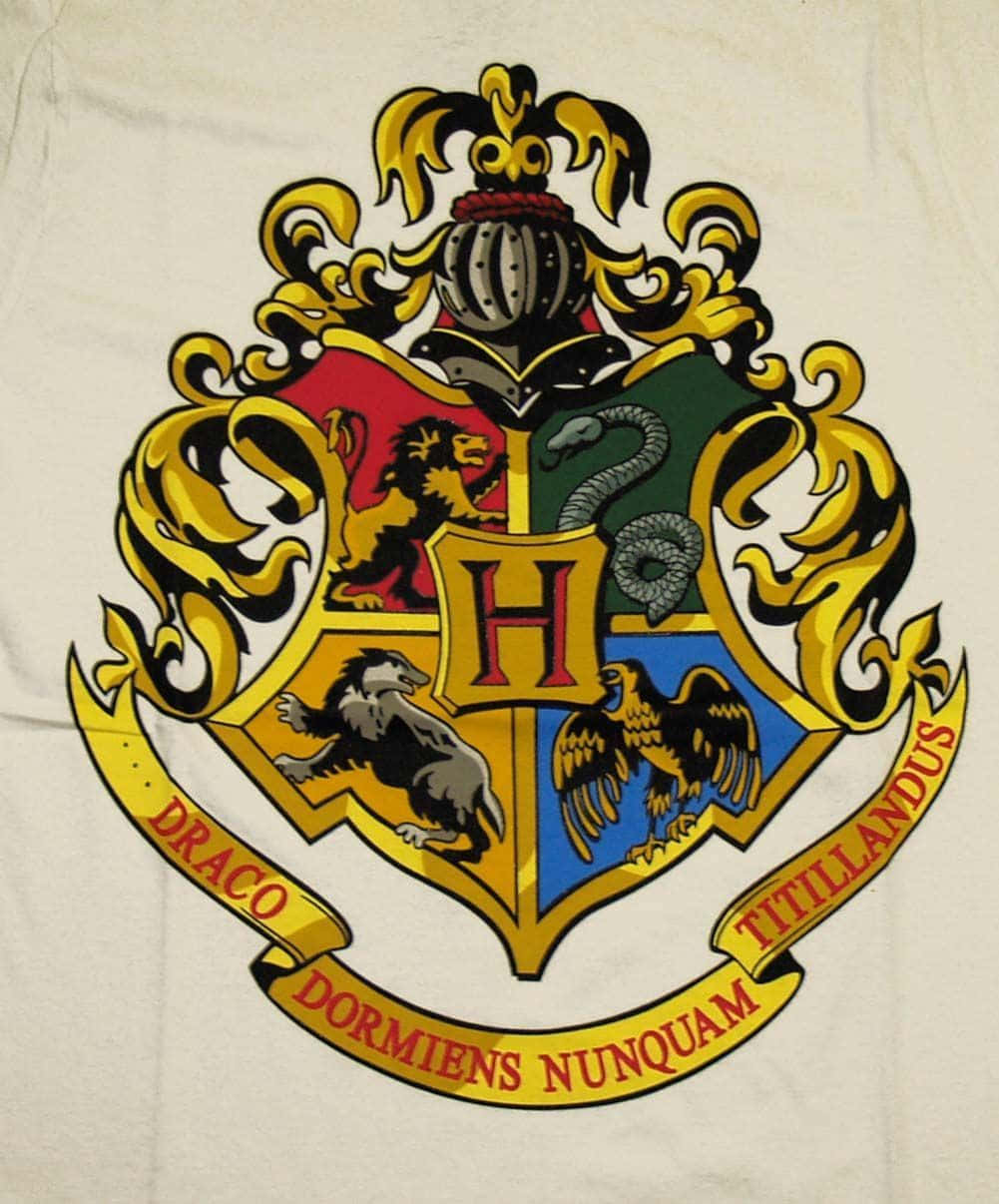 Hogwarts School Crest on a Magical Background Wallpaper