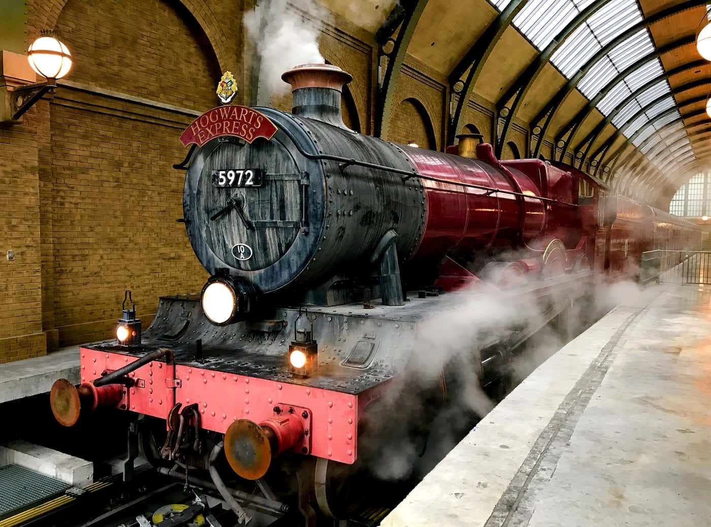 Hogwarts Express crossing a scenic countryside Wallpaper