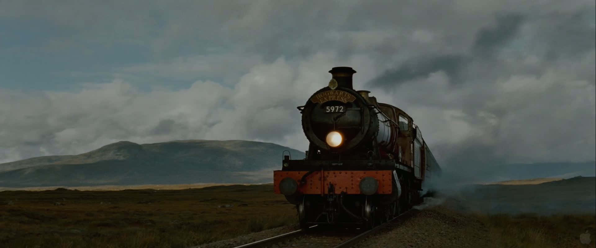 Hogwarts Express arriving at the magical railway platform Wallpaper