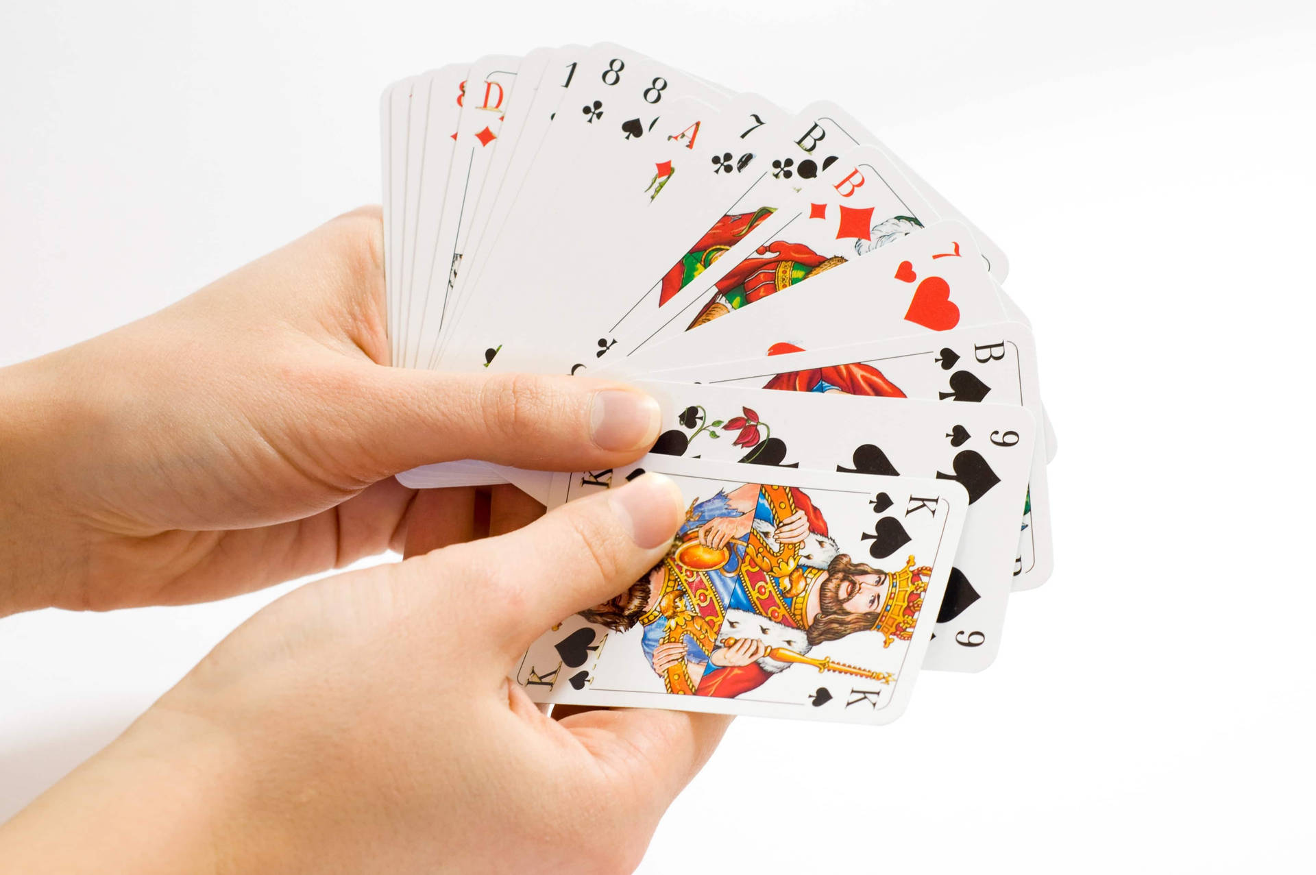 Holding A Rummy Deck Of Cards Wallpaper