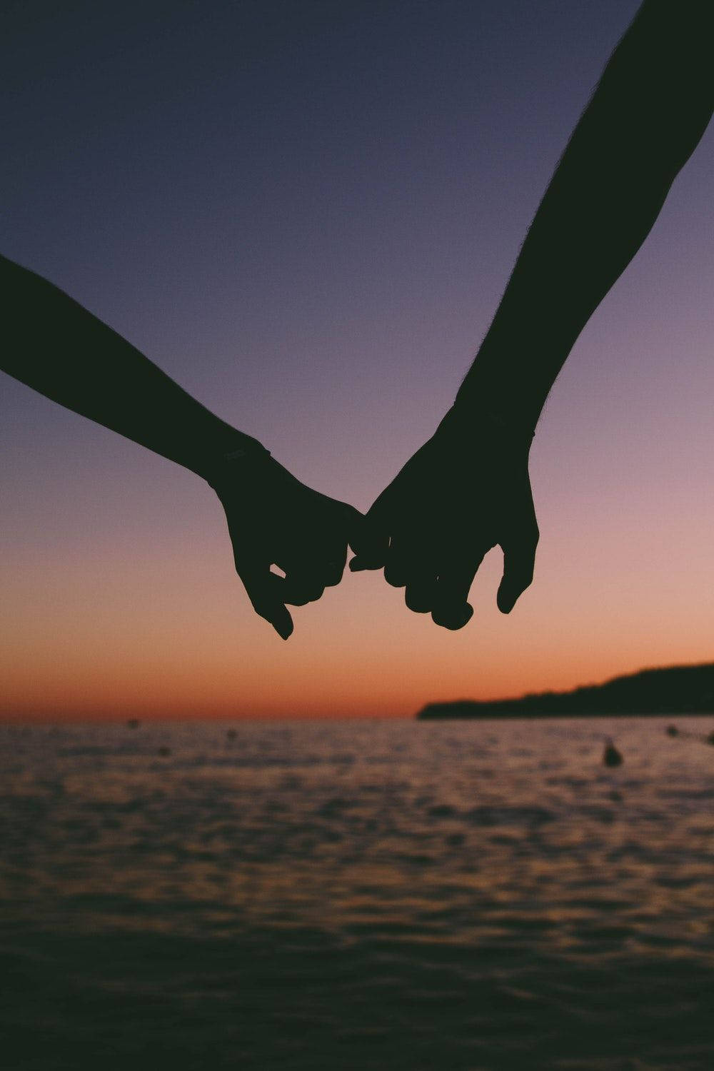 Holding Hands Silhouette At Sea Sunset Wallpaper