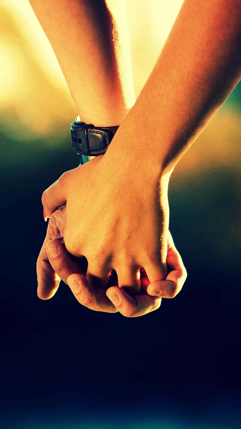 Download Holding Hands Sunset Backdrop Wallpaper | Wallpapers.com