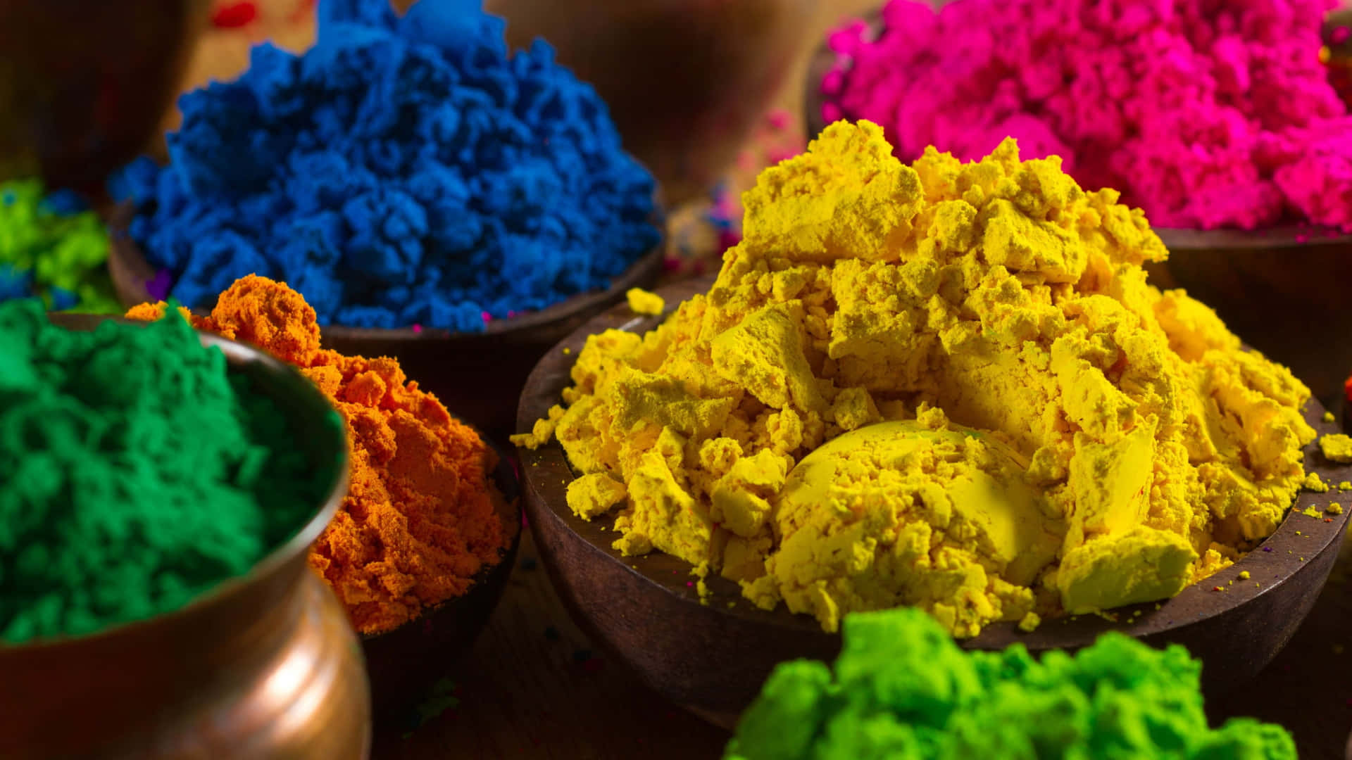 Holi Powder In Bowls On A Wooden Table