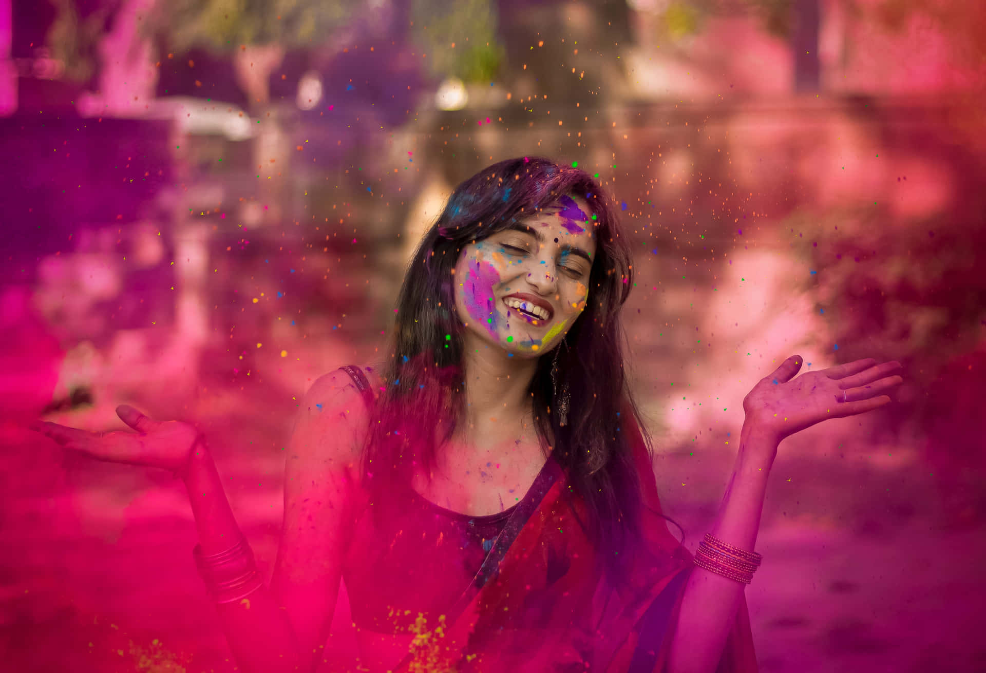 holi girl with colorful powder on her face