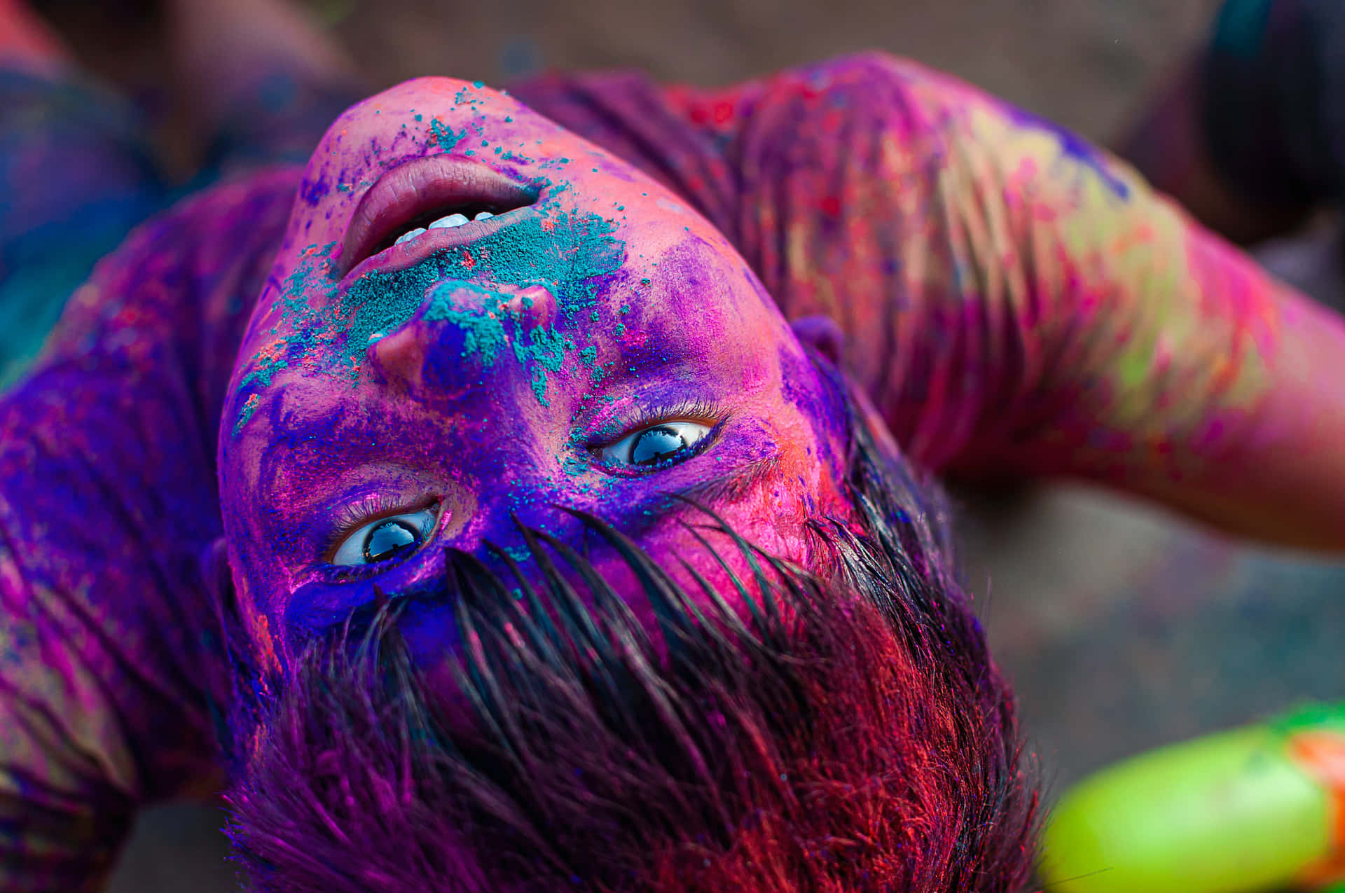 a boy with colorful paint on his face
